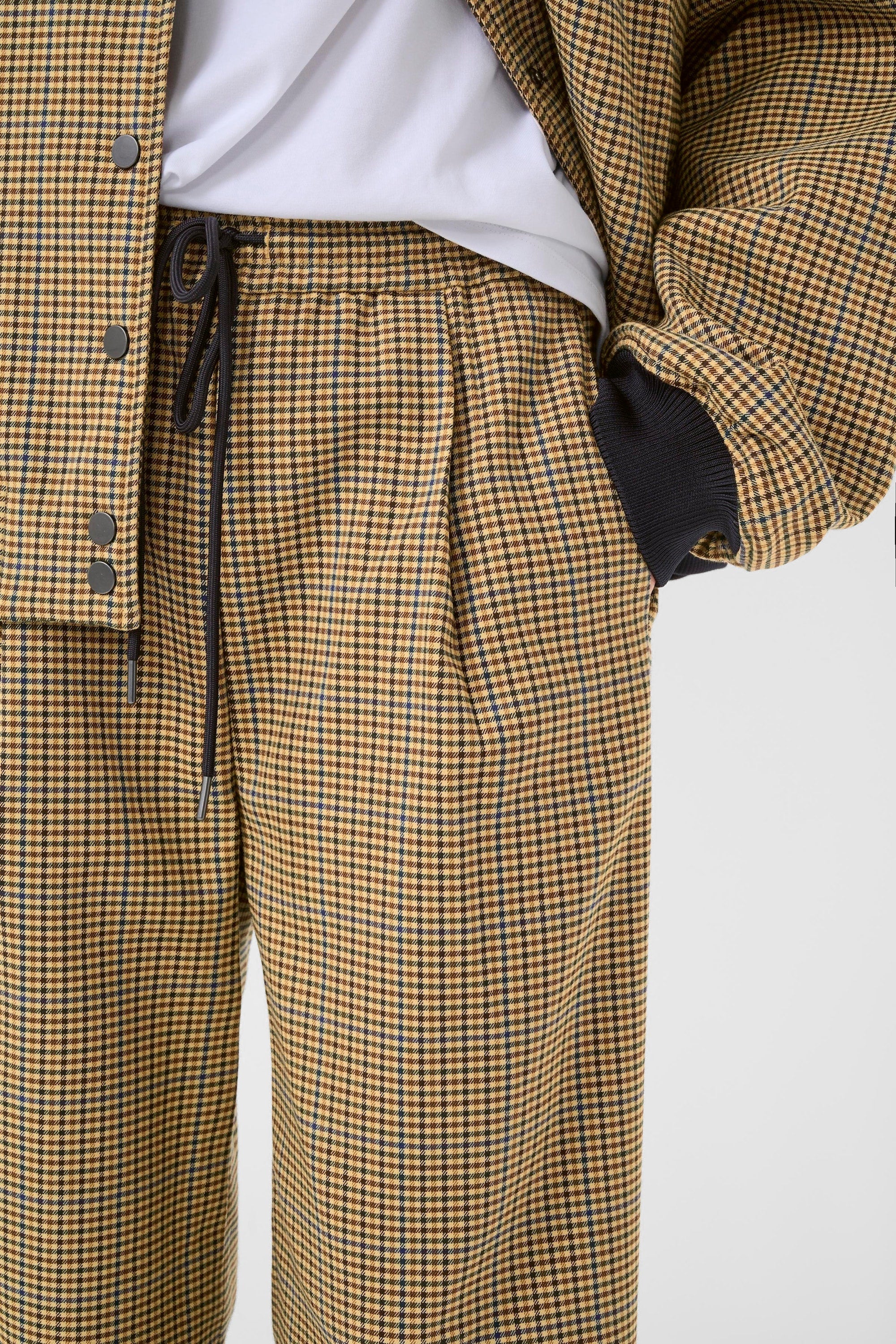 Weite, karierte Trackpants